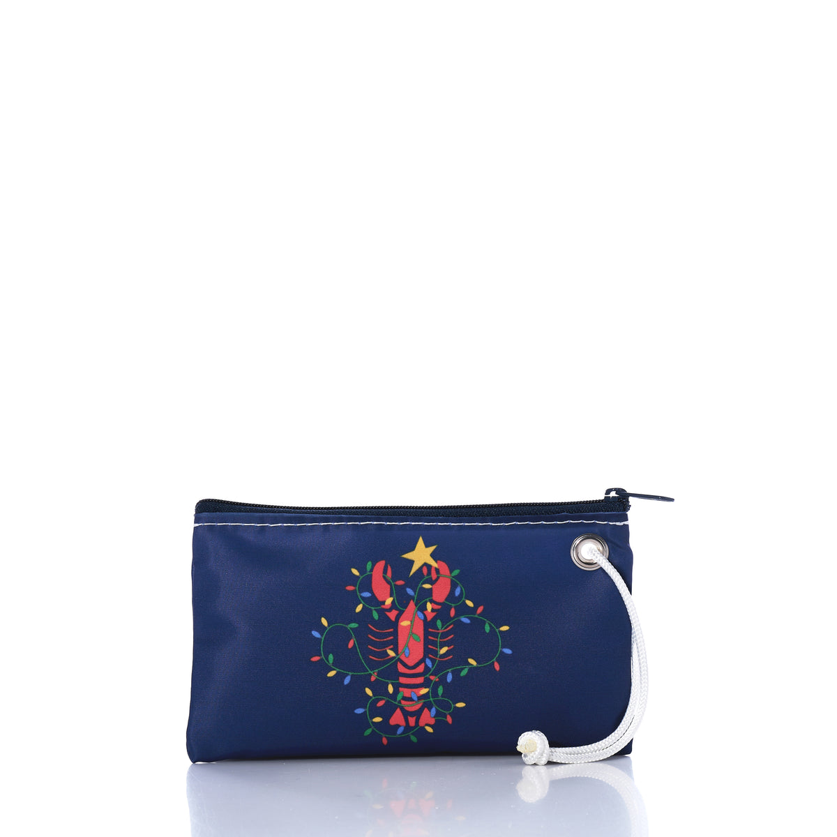 Introducing the Sea Bags Lobster Lights Wristlet: this navy blue zippered pouch with a wrist strap features a festive red lobster adorned with colorful holiday lights and topped with a yellow star. Made from recycled sail cloth, it’s a unique and sustainable gift choice. by Sea Bags