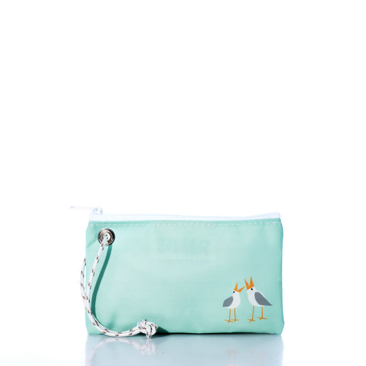 Mint green clutch bag with bird design on a white background