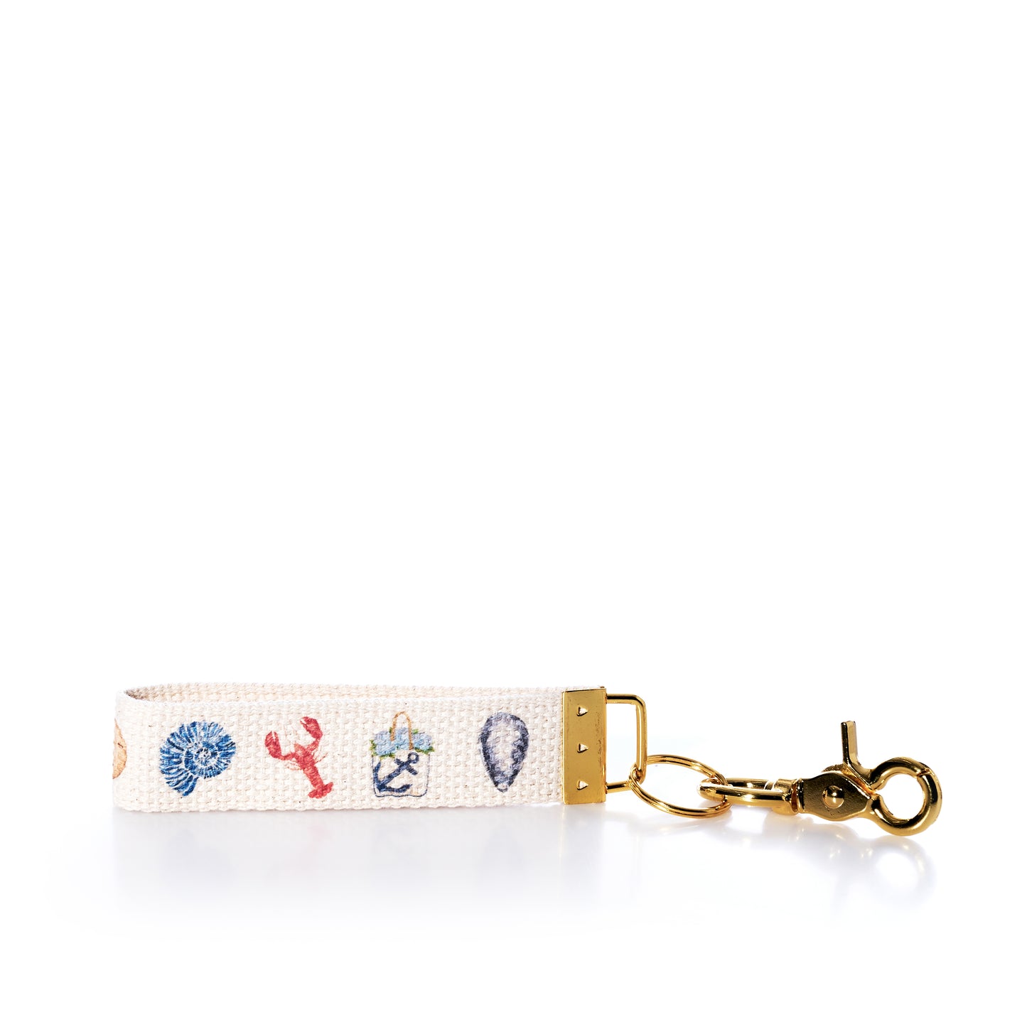Keychain with lobster, crab, and shell designs on a white background