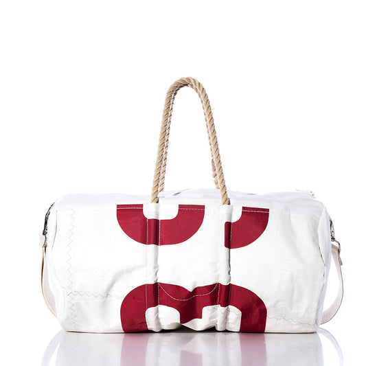 Sea Bags Vintage 539 Duffel, crafted from recycled sail cloth, features red circular patterns, hemp rope handles, and a shoulder strap; shown on a white background. by Sea Bags
