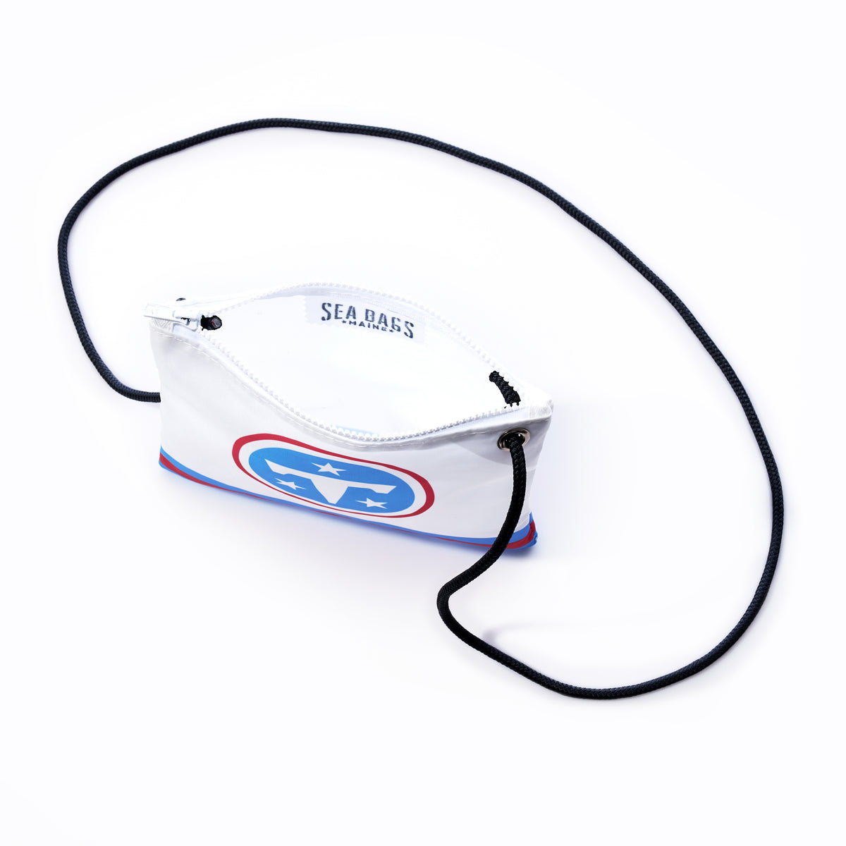 A white Sea Bags Tennessee Titans Slim Crossbody, made from recycled sail cloth, features a navy, red, and light blue logo graphic and a long, thin, patterned rope strap—this sustainable crossbody bag is set against a plain white background. by Sea Bags