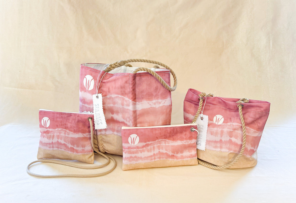 Four Sea Bags items in a pink and beige tie-dye pattern, including two tote bags with rope handles and two zip pouches.