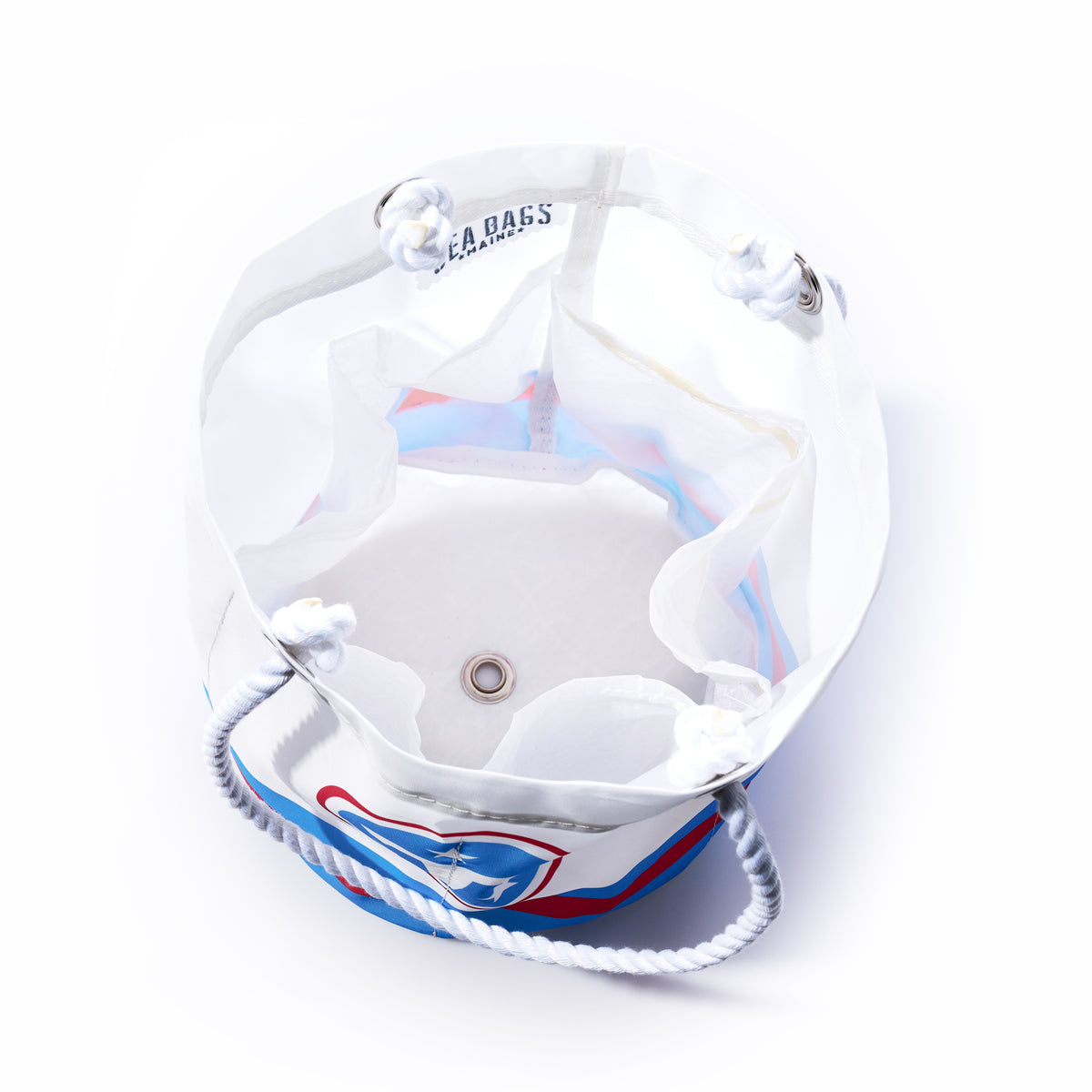Introducing the Tennessee Titans Beverage Bucket by Sea Bags—a sustainable cooler crafted from recycled sail cloth in white mesh, complete with rope handles, metal grommets, and a round metal drainage hole at the bottom. Seen from above on a white background, this eco-friendly beverage bucket is an ideal choice for gatherings and tailgates alike.