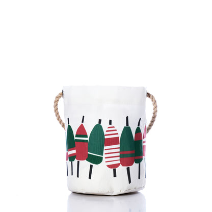 The Sea Bags Holiday Buoys Bucket Bag features rope handles, is made from recycled sail cloth, and displays cheerful green and red buoy illustrations—an ideal coastal holiday décor accessory shown on a white background. by Sea Bags