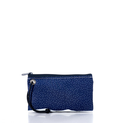 The Sea Bags Midnight Snow Wristlet features a small navy blue zippered pouch adorned with white polka dots and finished with a black wrist strap, shown against a white background—this sustainable accessory is perfect for winter, keeping your essentials secure in style. by Sea Bags