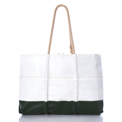 The Sea Bags Trapline Large Tote - Dark Green features a spacious white design with a dark green bottom, sturdy rope handles, and visible stitching. Made from recycled sail cloth and inspired by the rugged gear of Maine lobster fishermen, it’s shown against a white background. by Sea Bags