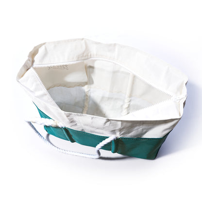 The Ocean Teal Beachcomber Tote by Sea Bags is shown open from above on a white background, featuring green and white canvas with sturdy white rope handles and a spacious, empty interior—a perfect sand-proof beach bag for your summer adventures. by Sea Bags