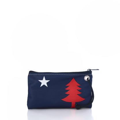 The 250th Patriotic Pine Wristlet by Sea Bags is a small navy blue zippered pouch, crafted from recycled sailcloth and adorned with a white star and red pine tree design—perfect as a patriotic bag or Maine wristlet, shown here against a white background. by Sea Bags