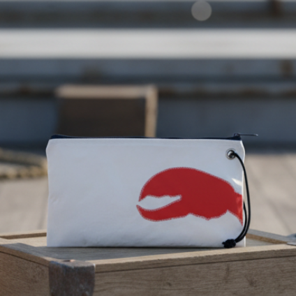 White pouch with a orange claw graphic on a white background