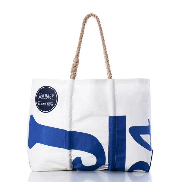 Race Day Vintage J24 Large Tote by Sea Bags, crafted from recycled sail material with blue designs and a sturdy rope handle. Features a SEA BAGS SAILING TEAM logo patch on the upper left corner. Photographed on a white background. by Sea Bags
