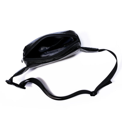 The Sea Bags Black Dragon Belt Bag is shown with its adjustable strap, unzipped to reveal the empty main compartment against a white background. Crafted from water-resistant material, this versatile crossbody bag makes a practical and unique gift for anyone on the go. by Sea Bags