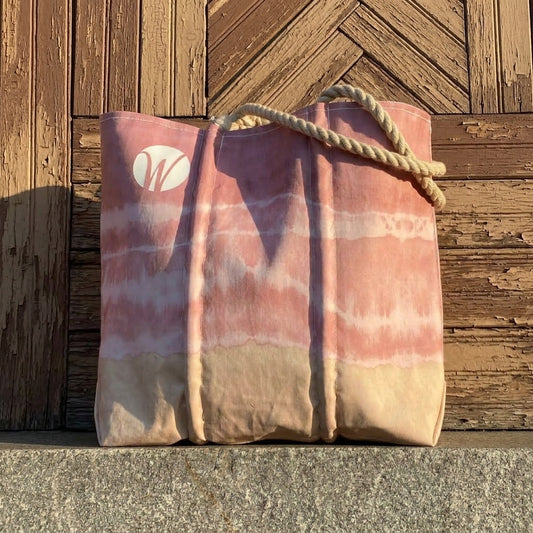 Shoreline Blush Medium Tote in pink and tan tie-dye with hand-spliced rope handles and a circular white logo.