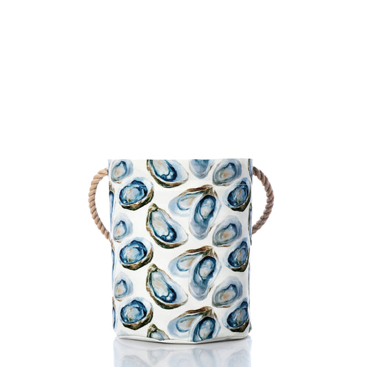 Ceramic basket with oyster shell pattern on a white background