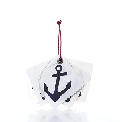 A stack of five square, white fabric Sail Cloth Gift Tag - Pack of 5 - Navy Anchor gift tags with pinked edges, each featuring a black anchor print and strung together with a red and blue cord.