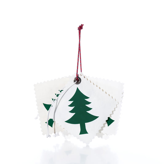 A pack of 5 Sail Cloth Gift Tag - Pine Tree, featuring five square recycled sail tags with pinked edges, green pine tree prints, and string for hanging.