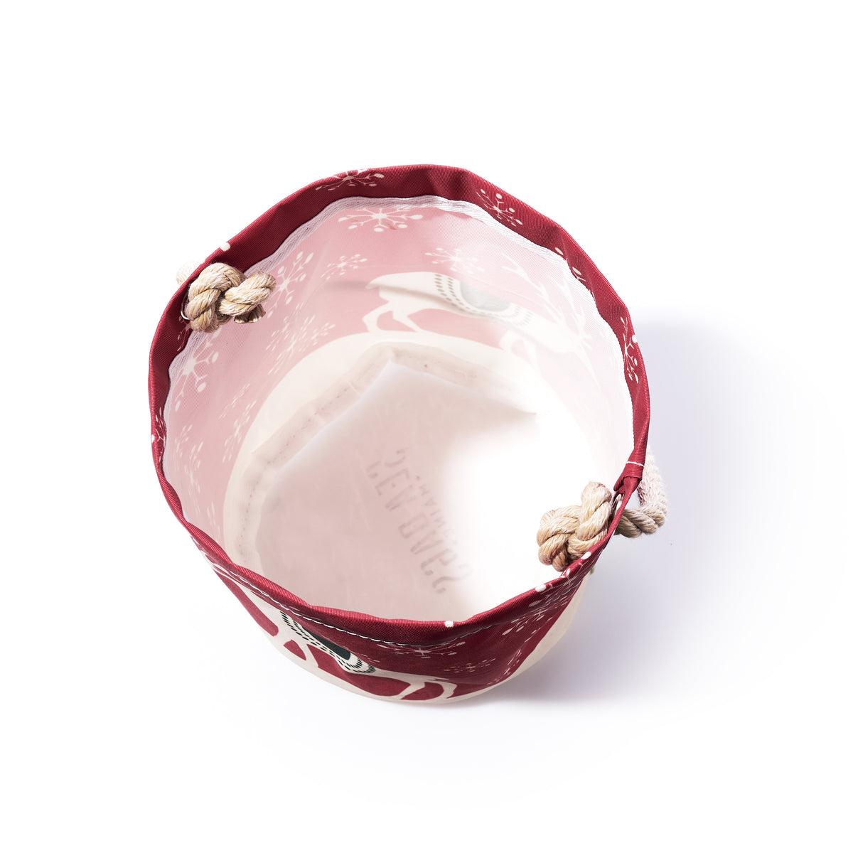 Scandinavian Holiday Bucket Bag made of recycled sailcloth, featuring a round shape, red rim, white geometric snowflake pattern, and rope handles.