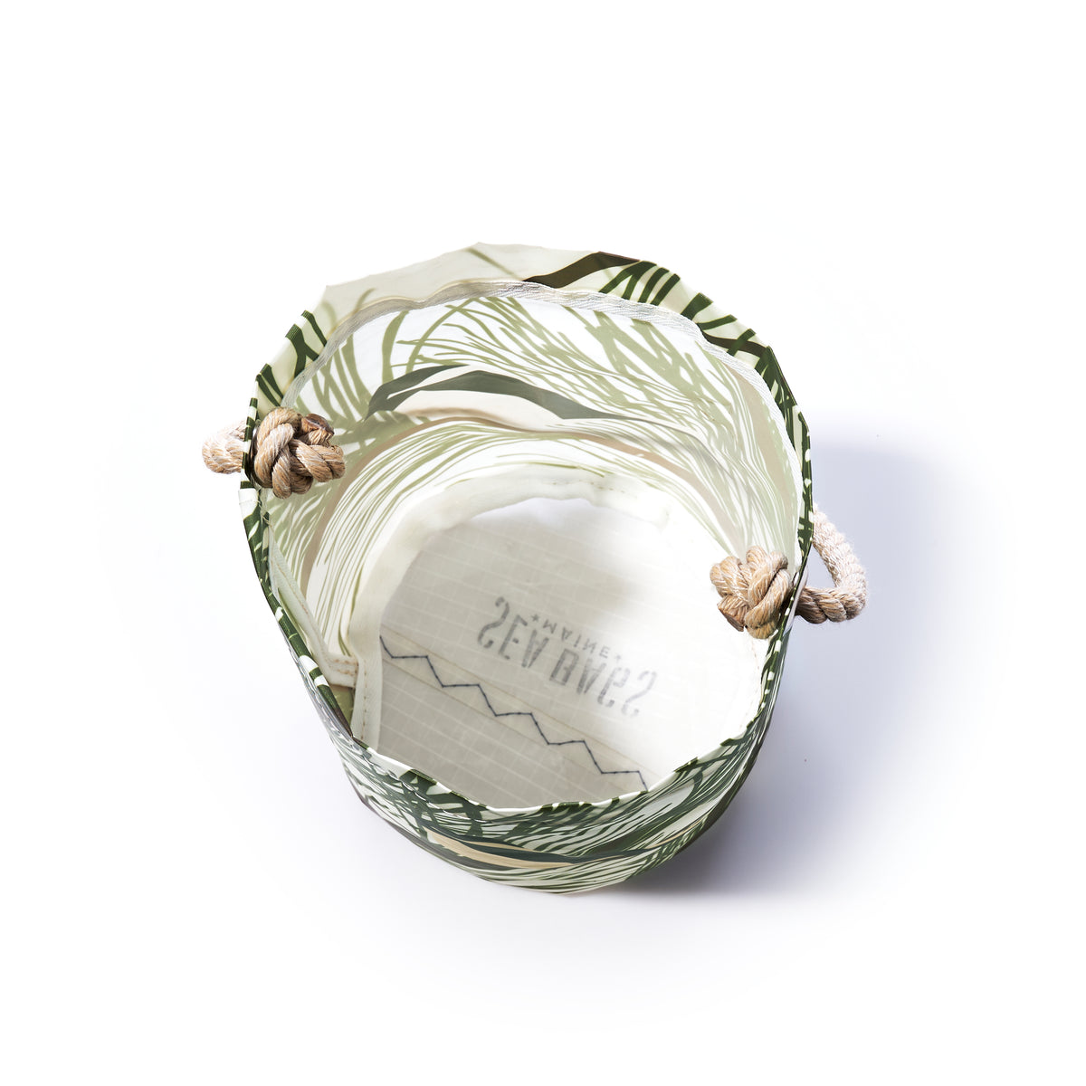 Maine Chickadee Bucket bag crafted from recycled sailcloth, featuring a green leaf pattern and thick rope handles knotted on the sides.
