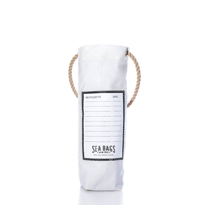 White cylindrical Pine Tree Wine Bag with rope handles and a printed blank label for writing recipient and date information.