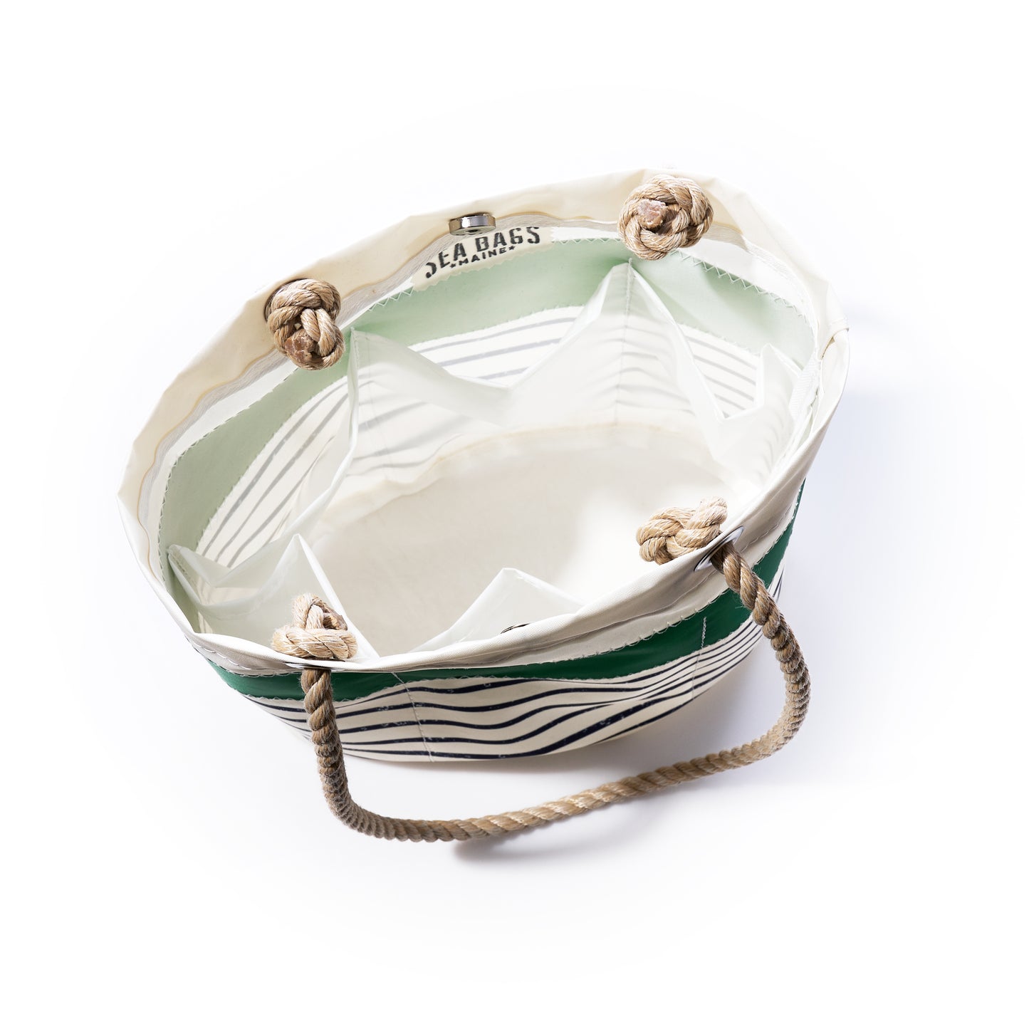 The Green-on-Navy Mariner Stripe Essential Handbag by Sea Bags is a practical and lightweight canvas bag crafted from recycled sail cloth, featuring green and white stripes, rope handles, and knotted corners. The interior includes multiple compartments for organization, with the Sea Bags brand name visible on the inner edge.