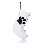 Paw Print Stocking with Personalized Sail Cloth Tag made of white recycled sailcloth with a black paw print design and red trim.