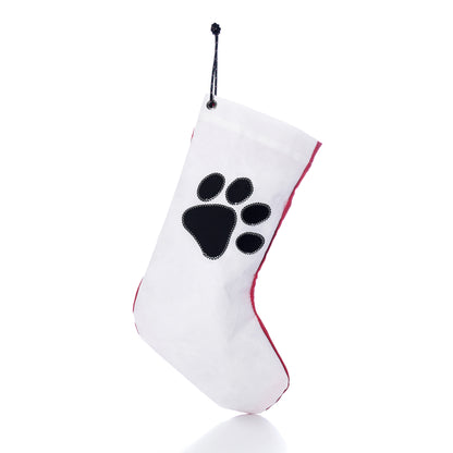 Paw Print Stocking with Personalized Sail Cloth Tag made of white recycled sailcloth with a black paw print design and red trim.