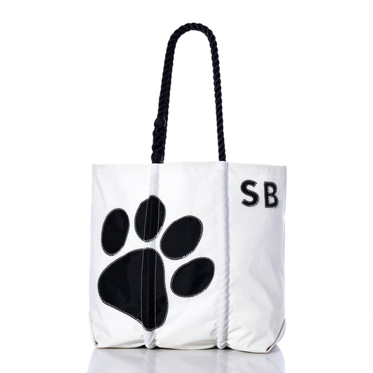 Introducing the Custom Monogram Paw Print Medium Tote by Sea Bags—a stylish, eco-friendly white tote made from durable recycled sailcloth. Featuring sturdy black rope handles, a bold black paw print design, and custom “SB” monogramming in the upper right corner, this personalized pet tote is perfect for any dog lover who values sustainable materials and thoughtful design.
