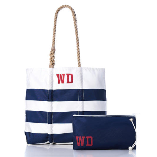 Sea Bags Custom Monogram Breton Stripe Medium Tote  Large Wristlet Bundle, featuring navy and white stripes with rope handles, both adorned with red WD monograms, crafted from recycled sailcloth for sustainability, displayed on a white background.