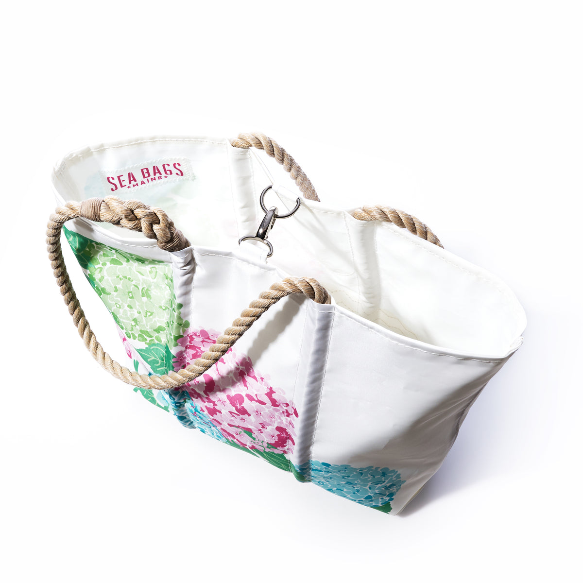 2026 Hope In Bloom Medium Tote with Clasp in sustainable sail cloth with rope handles, a metal closure, and a floral hydrangea print.
