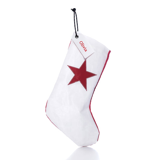 Red Star Stocking with Personalized Sail Cloth Tag in white, featuring a red star and a custom name-tag reading “Olivia.”