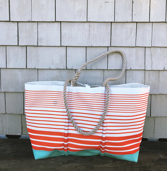 Sea Bags Orange Stripe Ogunquit Beach tote featuring orange horizontal stripes, a light blue bottom, and thick rope handles.