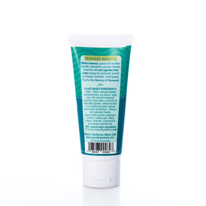 A 2 oz tube of Planet Botanicals Seaweed Hand Cream is shown standing upright, featuring a green and blue label on the back with ingredients and product information that highlight its nourishing seaweed formula inspired by coastal skincare traditions.
