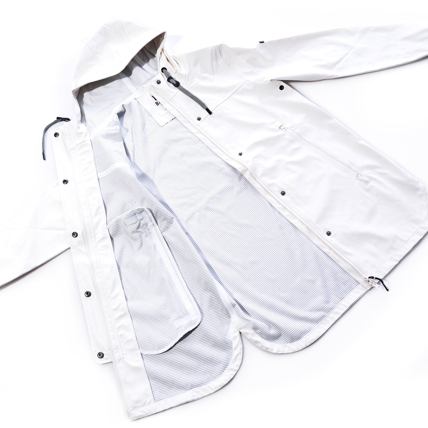 White jacket with zippers and mesh details on a white background