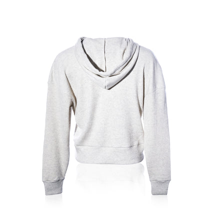 The Soft As A Grape Ribbed Hoodie Pullover - Oatmeal Anchor is shown from the back against a white background. This hoodie features long sleeves, a ribbed texture, and a relaxed fit for effortless coastal style. by Sea Bags