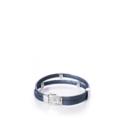 A Classic Cork Bracelet - Stripe Bands on Gray by Elisabetta Studio, featuring blue double-wrap Portuguese cork and a magnetic nickel-free silver clasp engraved with the brand name, displayed on a white background. by Sea Bags