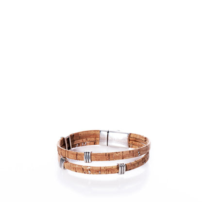 The Classic Cork Bracelet - Stripe Bands on Natural by Elisabetta Studio features double-layered, eco-friendly Portuguese cork leather with silver metal accents and a secure clasp, all beautifully showcased on a white background. by Sea Bags