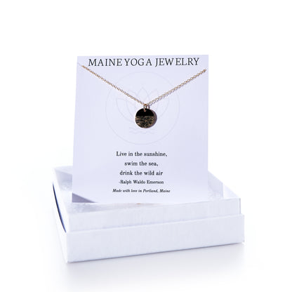 Introducing the Pendant Necklace - Horizon Gold by Maine Yoga Jewelry: this elegant gold pendant necklace features a meaningful Emerson quote on its display card and comes packaged in a white box labeled Maine Yoga Jewelry, making it a beautiful addition to any jewelry collection. by Sea Bags