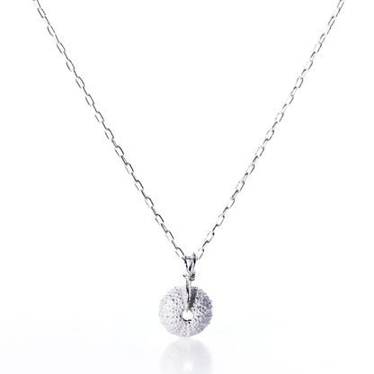 Pendant Necklace - Tiny Sea Urchin Silver by Maine Yoga Jewelry, featuring a delicate silver chain and a handcrafted circular pendant inspired by a sea urchin, adorned with small white gemstones, shown on a white background. by Sea Bags