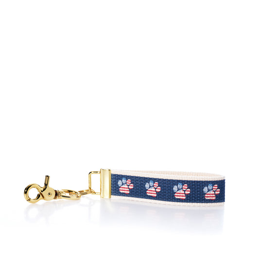 Keychain with paw print pattern on a white background