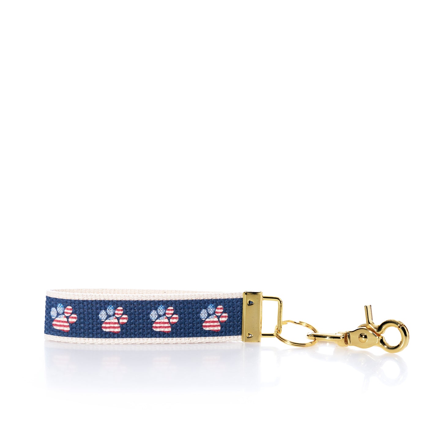 Keychain with paw print pattern on a blue background