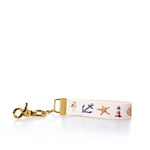 Keychain with nautical-themed design on a white background