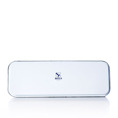 The Enamel Anchor Serving Tray by Batela USA Inc features a rectangular white metal design with rounded corners, a central blue Batela logo and text, and a reflective surface—perfect for effortlessly adding coastal charm to any space.