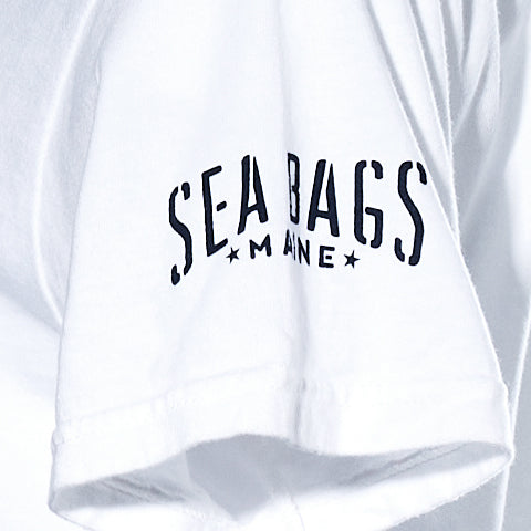 White Salty Wharf Seagull T-shirt sleeve with a screen-printed graphic reading “SEA BAGS MAINE” in navy blue ink.