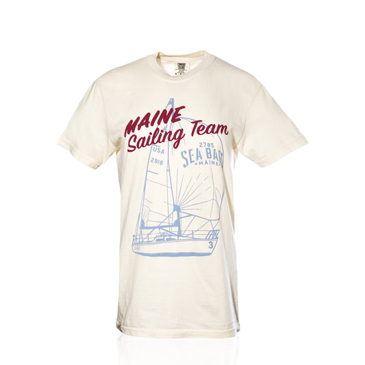 Off-white short-sleeve Maine Sailing Team T-Shirt with a blue sailboat graphic and red “Maine Sailing Team” text.