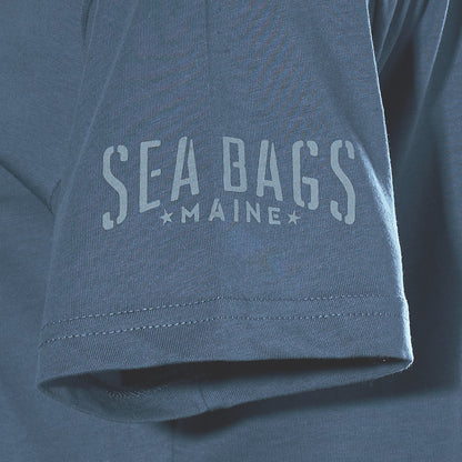 Close-up of a blue Sea Bags 06 Octopus T-Shirt sleeve by 320Ink d/b/a Riptide Print Company, featuring “SEA BAGS MAINE” in light letters.