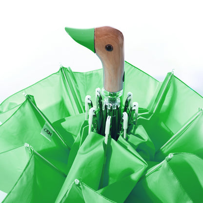 A bright green, wind-resistant Original Duck Head Umbrella - Matcha Green with a wooden duck-head handle.
