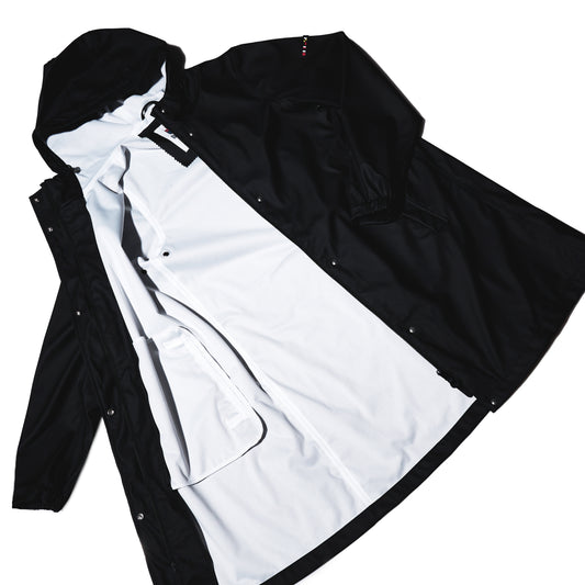 Harborside Waterproof Raincoat - Black hooded raincoat with a white lining, laid open to show the interior.