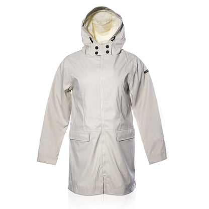 The Harborside Waterproof Fleece-Lined Raincoat - Moonstruck by Batela USA Inc is a long, light beige unisex coat with front pockets, dual closure, and a fleece-lined hood.