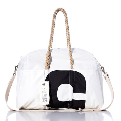 Introducing the Sea Bags Vintage Black 5 Weekender: a white duffel bag featuring sturdy rope handles, a striking vintage black number 5 design, a beige shoulder strap, and an authentic Sea Bags tag—ideal for your next getaway. by Sea Bags