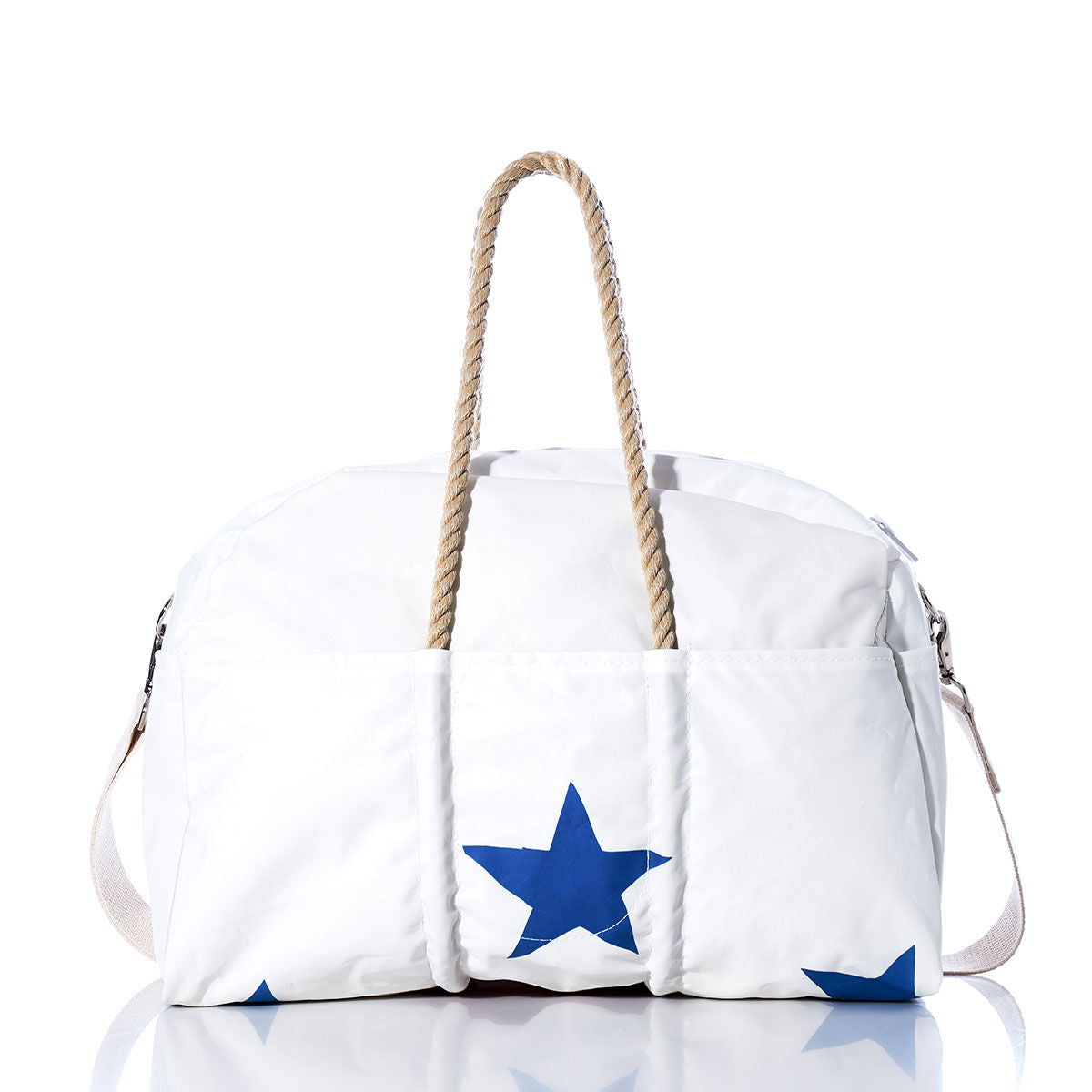 The Sea Bags Vintage Ensign Weekender, featuring blue star prints, rope handles, and a side shoulder strap, is displayed on a white background—making it the perfect stylish companion for your next getaway. by Sea Bags