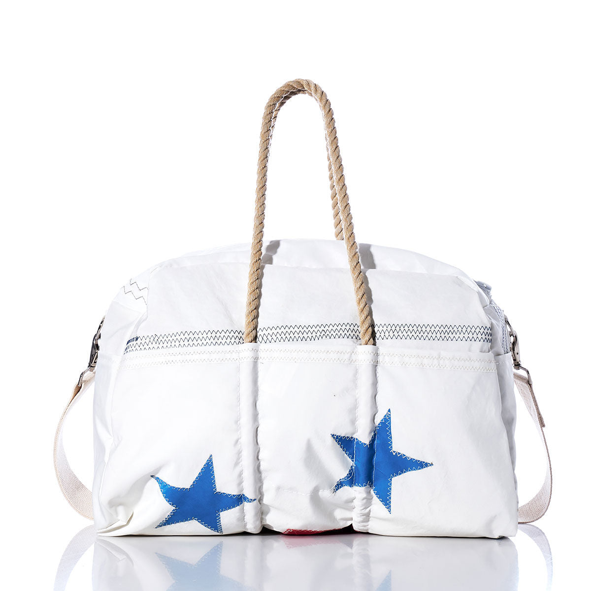 The Sea Bags Vintage Ensign Weekender, featuring blue stars, sturdy rope handles, and a shoulder strap, is showcased on a plain white background—an ideal and stylish choice for your next getaway. by Sea Bags